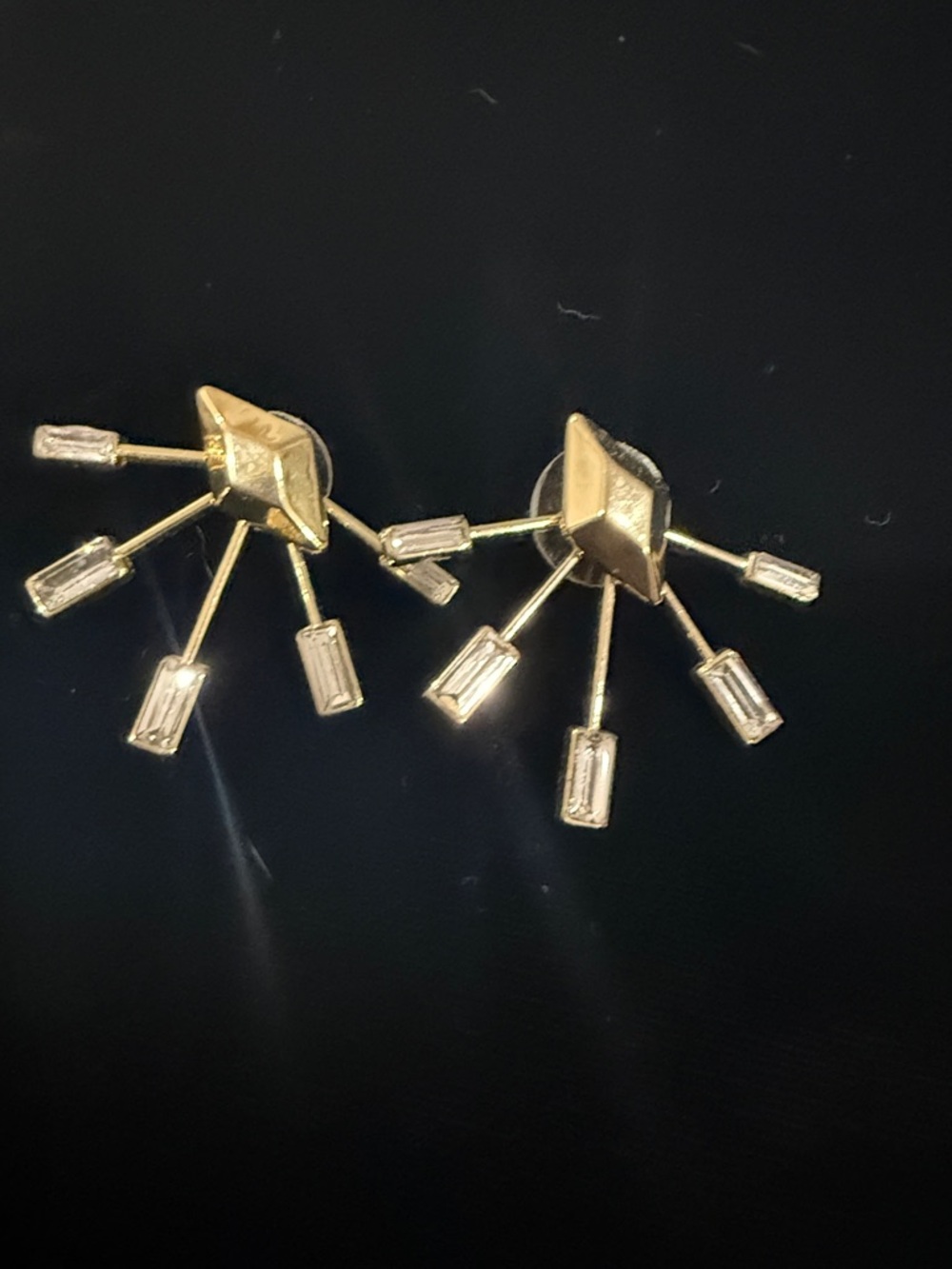 Gold Starburst Stud Earrings with Baguette Accents